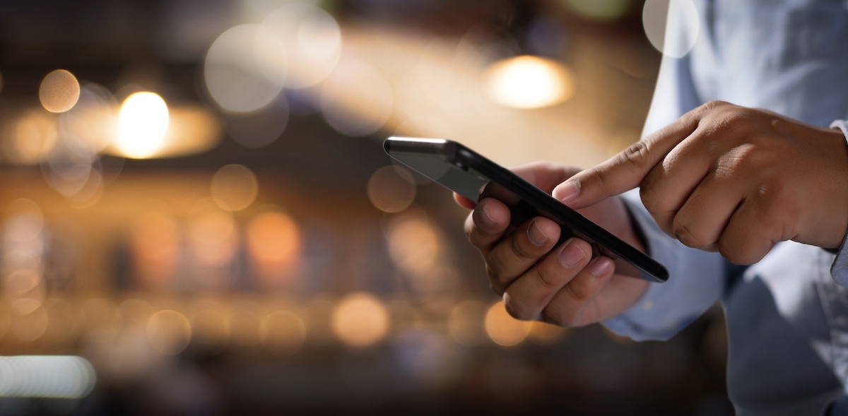 Man Browsing Website On Mobile 