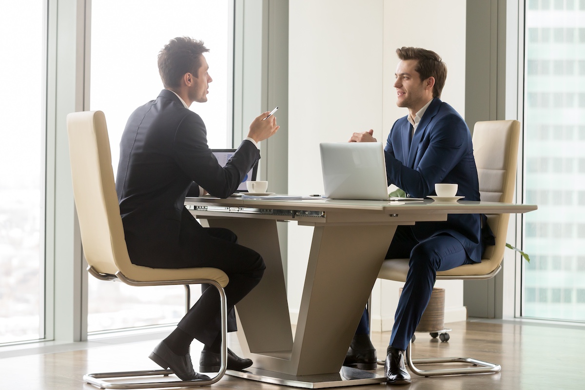 Two Businessmen Discussing How Much Does A Website Cost In Canada?