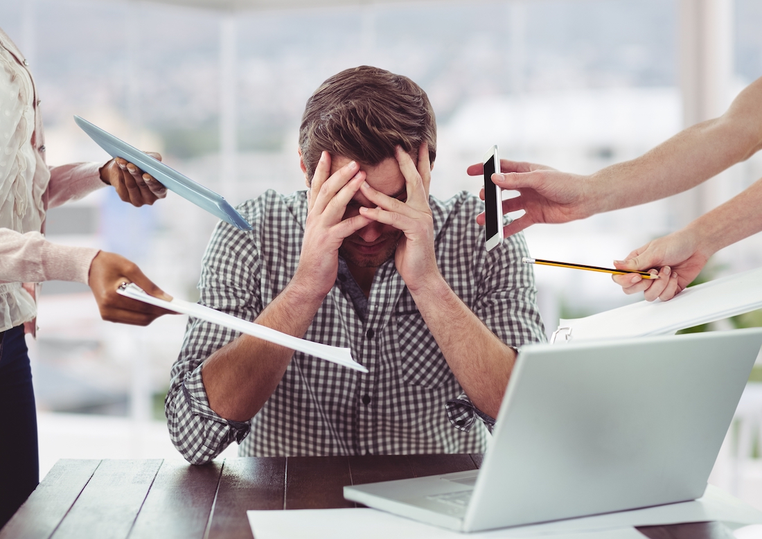 Stressed man frustrated over laptop