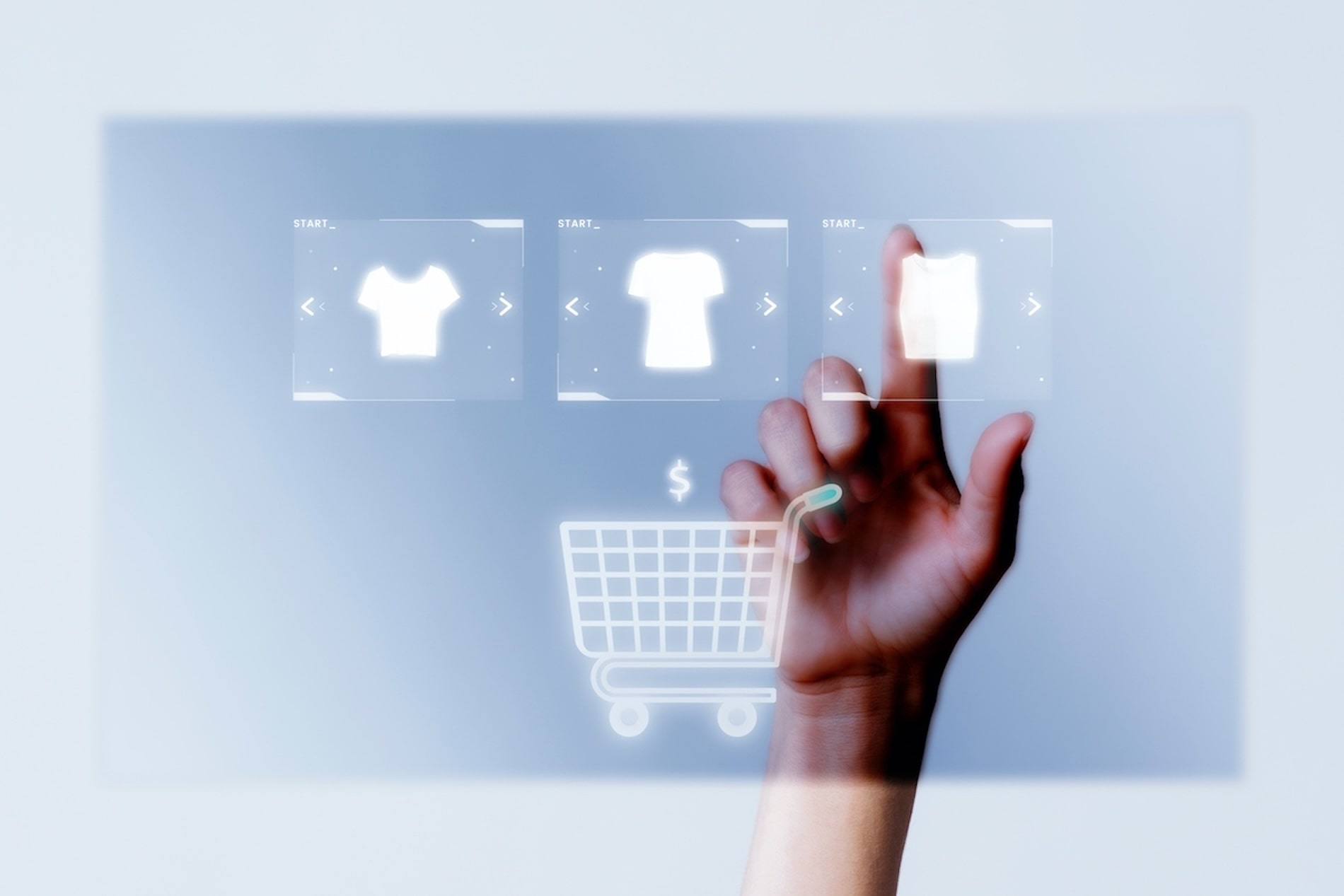 Hand adding clothes to digital shopping cart