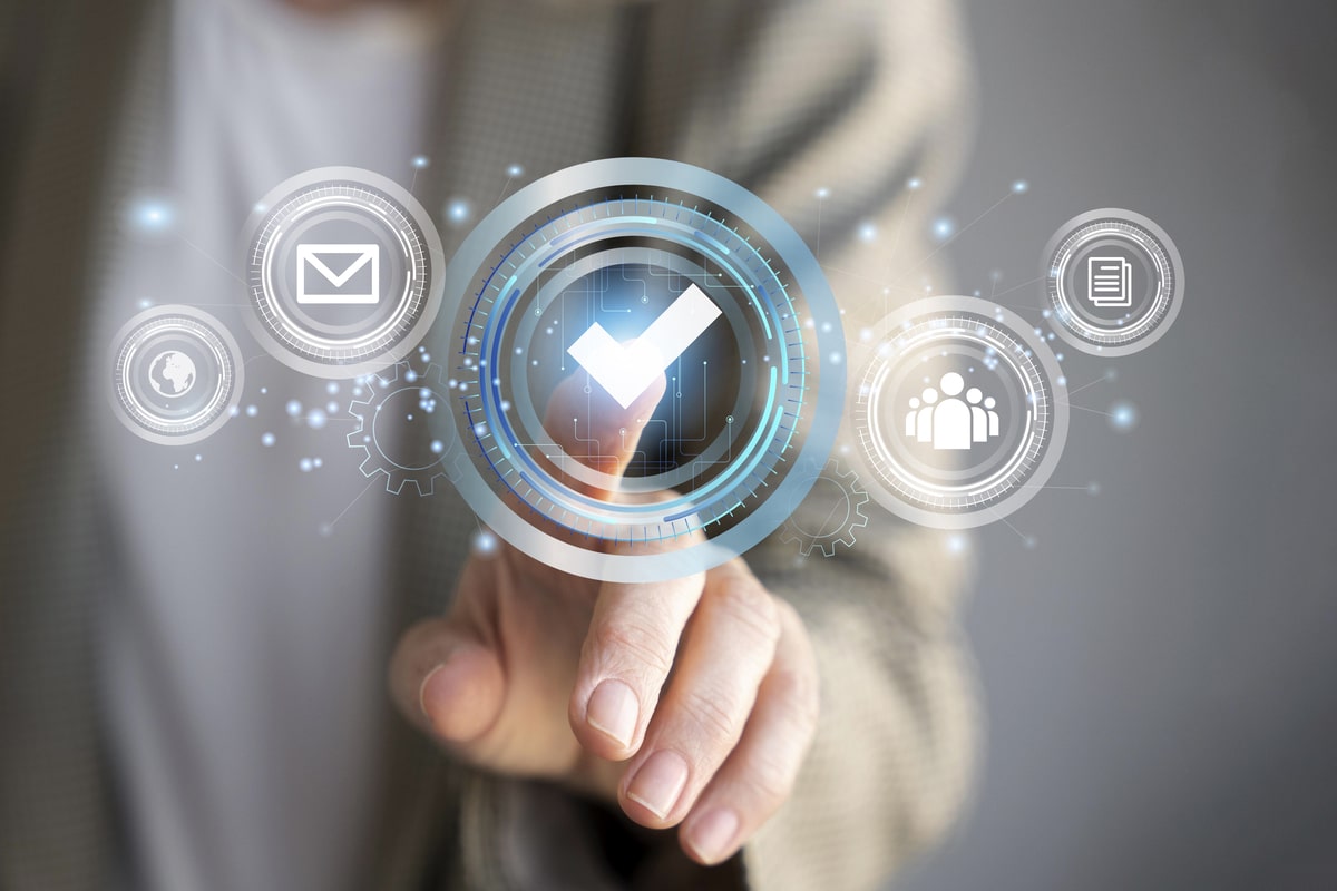 How To Choose Keywords For Seo 7 Person Pressing Checkmark On Digital Interface With Icons For Email, Analytics, Team, And Quality Control